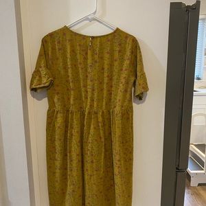 Mustard ROLEE brand baby doll waisted dress. Size Large. Cute ruffles sleeve.